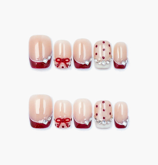 Crimson Dot Press-On Nails – Nude Base with Crimson Tips, Teardrop Gems, and 3D Red Bow, short square Full-Cover Set