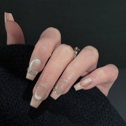 Athena French Tip Cat Eye Press-On Nails – Soft Nude with Gems Chain, Worn on Hand