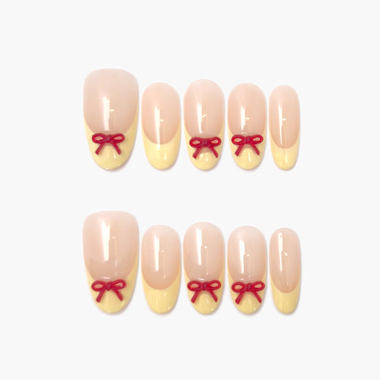 Buttercup Bow Press-On Nails – Sheer Nude with Yellow French Tip and 3D Red Bow, Medium Oval Full-Cover Set
