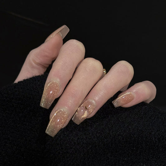 Peachy Cat Eye Press-On Nails – Pink & Gold Glitter with 3D Peach Design, Worn on Hand