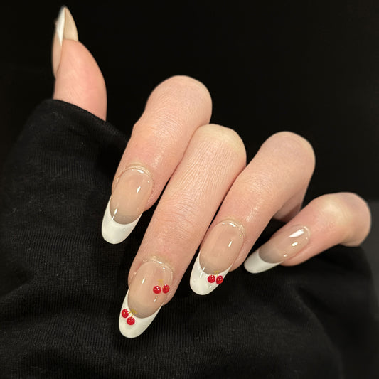 Cherry Kiss French Tip Cherry Press-On Nails – Nude Base with Cherry Design, Worn on Hand