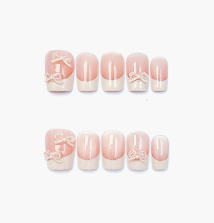 Ballerina Press-On Nails – Nude Base Cat Eye with French Tip and 3D White Bow Charms, short Coffin Full-Cover Set