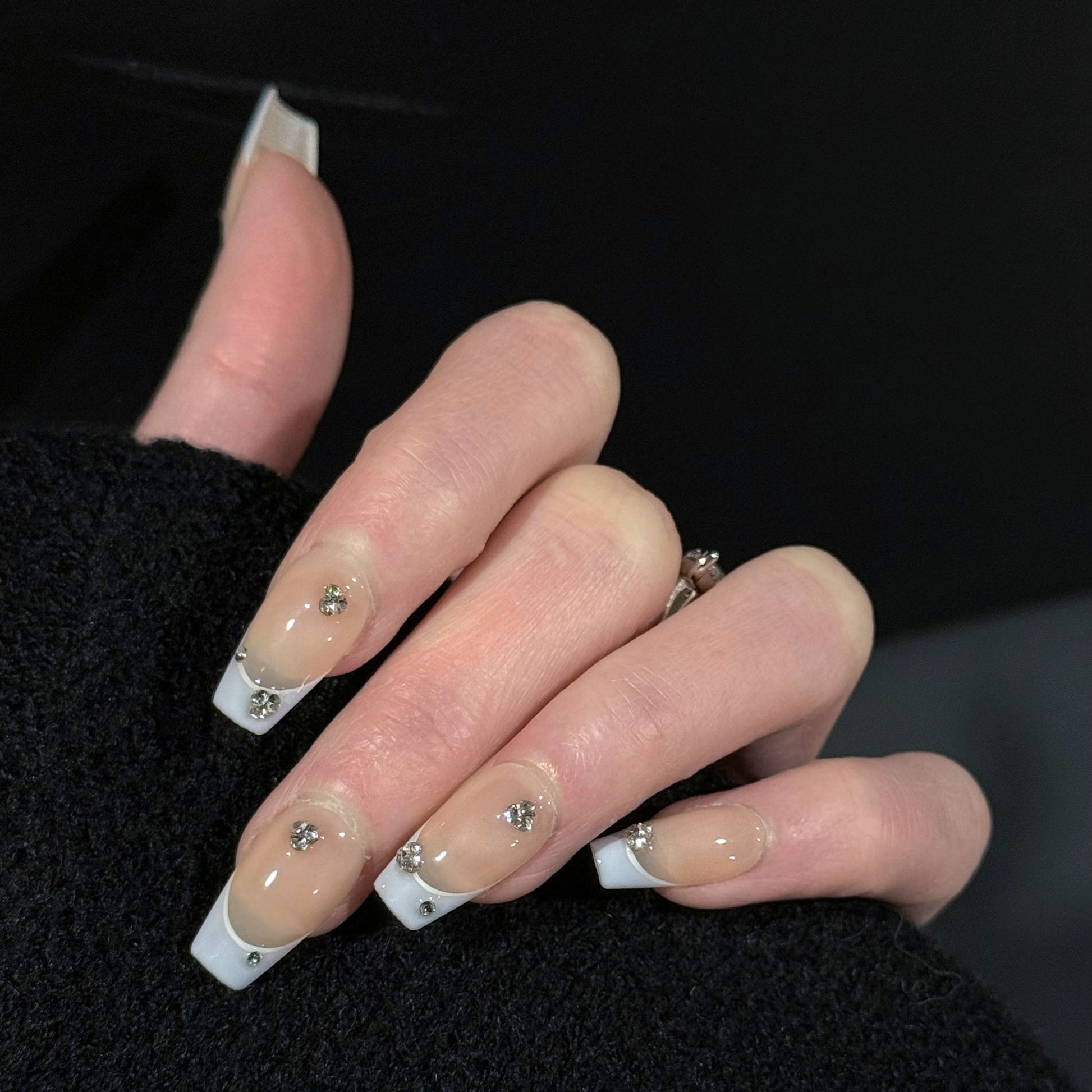 Gems Dew French Tip Gems Press-On Nails – Nude with Light Purple Tips & Gems Accents, Worn on Hand