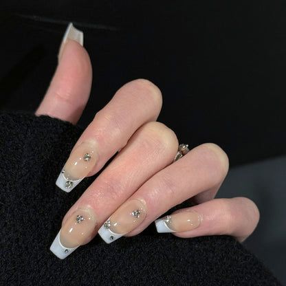 Gems Dew French Tip Gems Press-On Nails – Nude with Light Purple Tips & Gems Accents, Worn on Hand