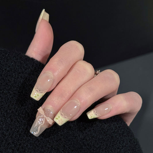 I Do French Tip Press-On Nails – Nude Base with 3D Pink Bow Charm, Worn on Hand