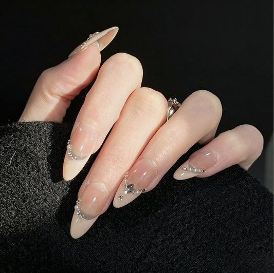 Chain of Hearts Gems French Tip Press-On Nails – Nude Base with Pearls & Teardrop Accents, Worn on Hand