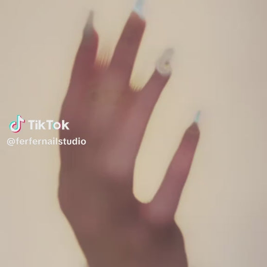 Video: Tropical Paradise Press-On Nails – Nude & Light Blue Gradient Cat Eye with 3D Flower Charms, Medium Coffin Nails, Showing Application and Wear