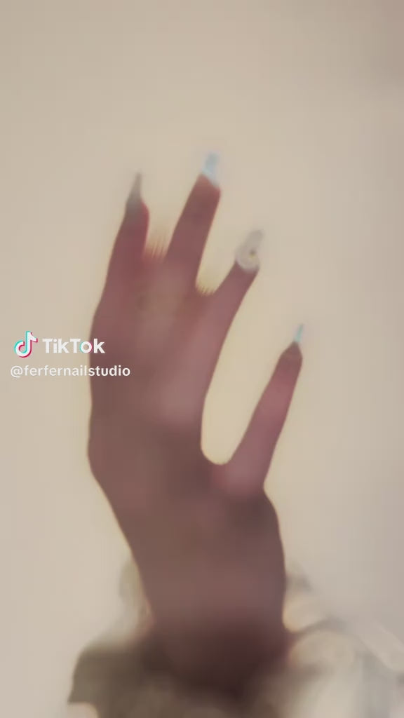 Video: Tropical Paradise Press-On Nails – Nude & Light Blue Gradient Cat Eye with 3D Flower Charms, Medium Coffin Nails, Showing Application and Wear