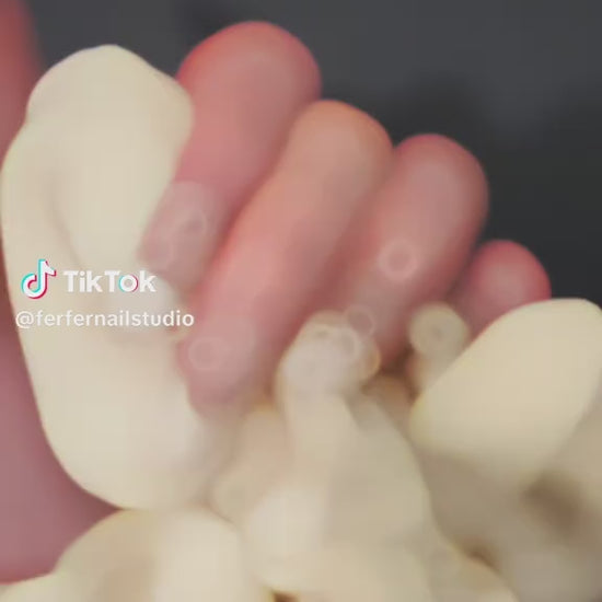 Video: Ballerina Press-On Nails – Nude Base French Tip with 3D White Bow Charms, medium Coffin Nails, Showing Application and Wear