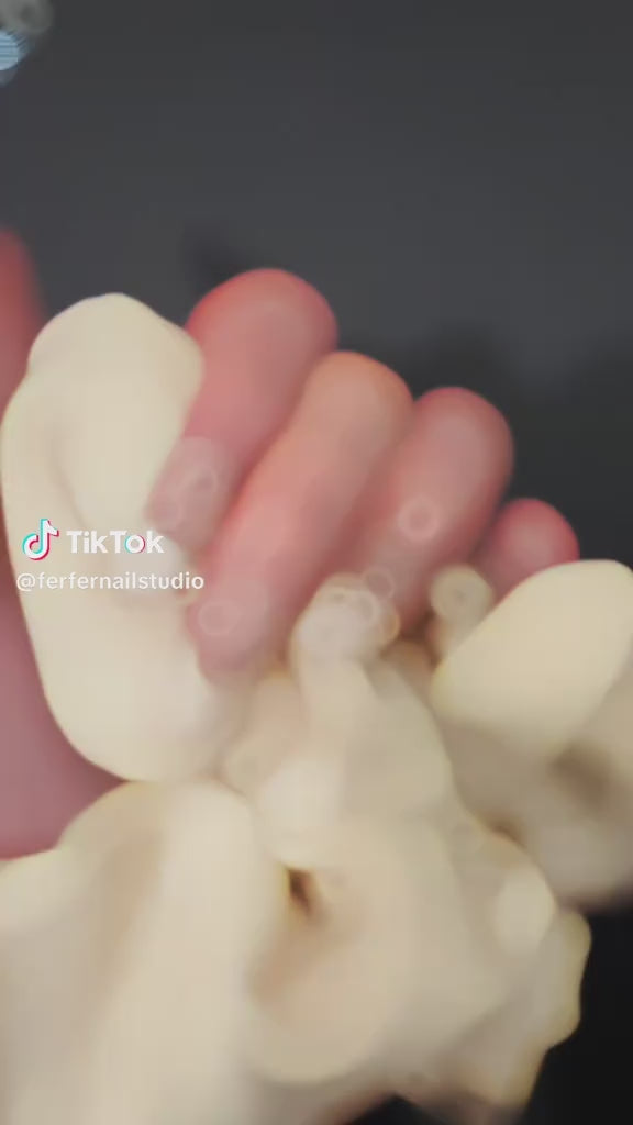 Video: Ballerina Press-On Nails – Nude Base French Tip with 3D White Bow Charms, medium Coffin Nails, Showing Application and Wear