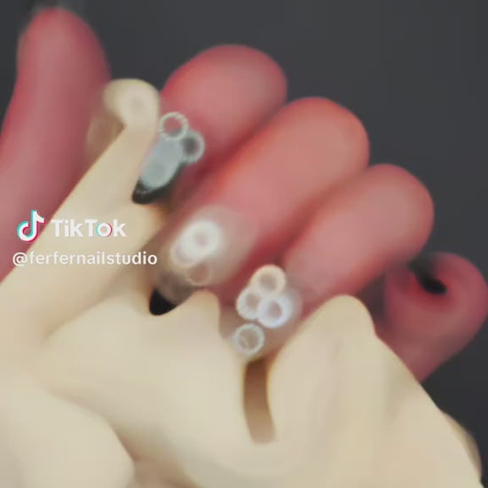Video: Noir Press-On Nails – Silver & Black Gradient Cat Eye with 3D Black Bow, Medium Oval Nails, Showing Application and Wear