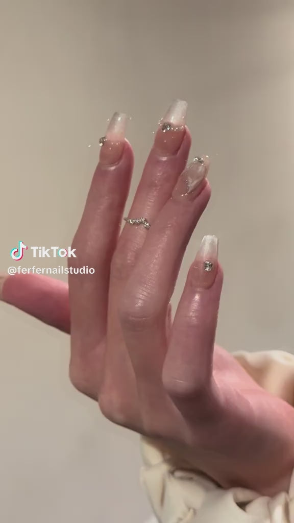 Video: Mermaid Tales Press-On Nails – Nude Cat Eye with 3D Mermaid Tail Charms and Gems Accents, Medium Coffin Nails, Showing Application and Wear
