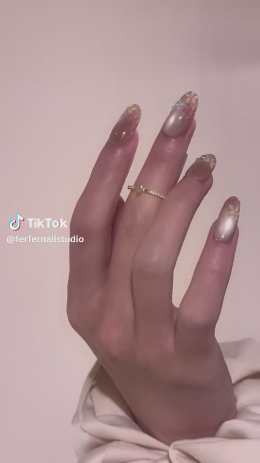 Video: Petal Breeze Press-On Nails – Soft Gradient Cat Eye with 3D Purple Petal Accents, Medium Oval Nails, Showing Application and Wear
