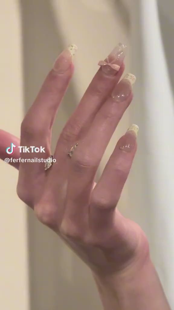 Video: I Do Press-On Nails – Nude French Tip with 3D Pink Bow and Leaf Details, Medium Coffin Nails, Showing Application and Wear