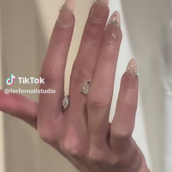 Video: Chain of Hearts Press-On Nails – Nude Base with Pearls & Gems Chain and Teardrop Accent, Medium Almond Nails, Showing Application and Wear