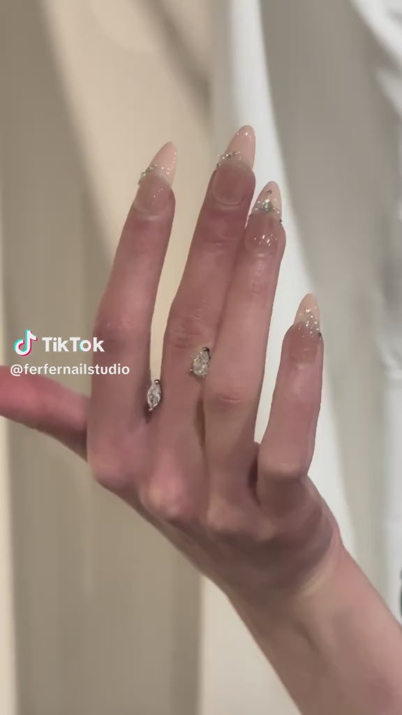 Video: Chain of Hearts Press-On Nails – Nude Base with Pearls & Gems Chain and Teardrop Accent, Medium Almond Nails, Showing Application and Wear