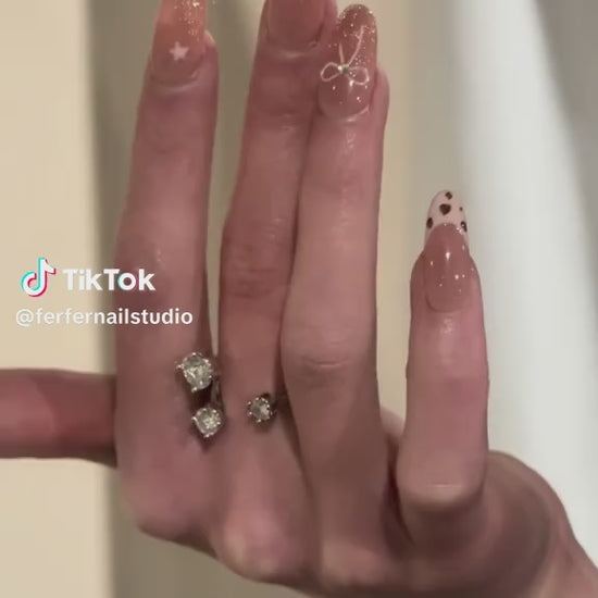 Video: Cowgirls Press-On Nails – Warm Nude French Tip with Star & Pink Bow Accents, Medium Oval Nails, Showing Application and Wear
