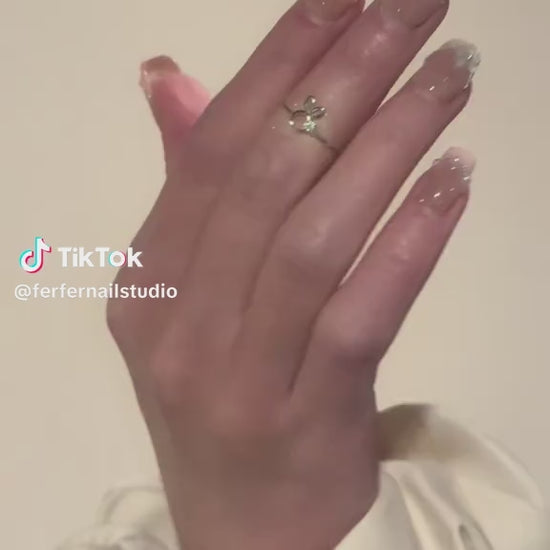 Video: In the Clouds Press-On Nails – Pink French Tip with Pearls Chain and Blue Flower Accents, Medium Square Nails, Showing Application and Wear
