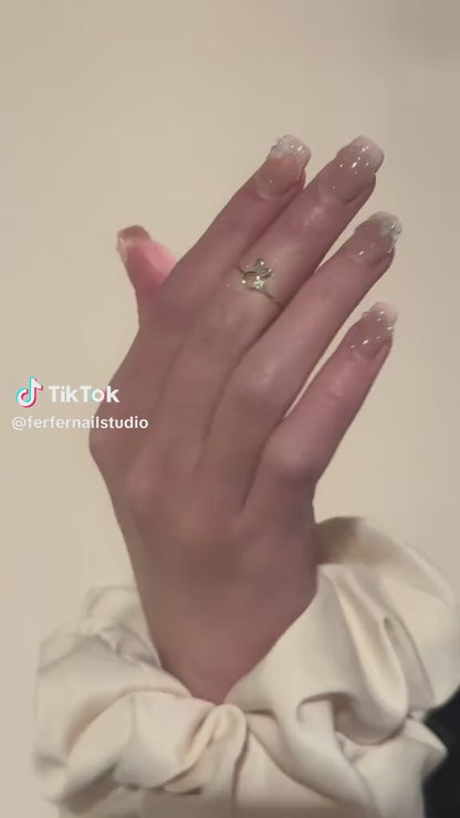Video: In the Clouds Press-On Nails – Pink French Tip with Pearls Chain and Blue Flower Accents, Medium Square Nails, Showing Application and Wear
