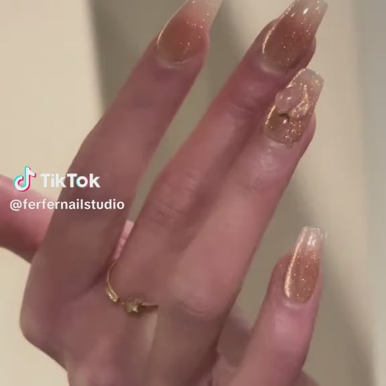 Video: Peachy Press-On Nails – Pink & Gold Glitter Cat Eye with 3D Peach Design, Medium Coffin Nails, Showing Application and Wear