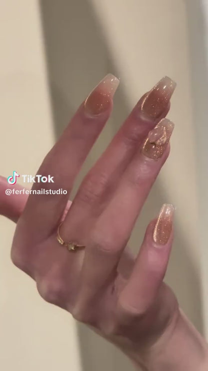 Video: Peachy Press-On Nails – Pink & Gold Glitter Cat Eye with 3D Peach Design, Medium Coffin Nails, Showing Application and Wear