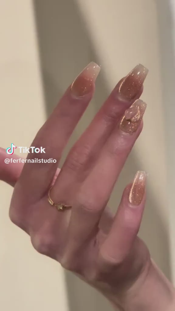 Video: Peachy Press-On Nails – Pink & Gold Glitter Cat Eye with 3D Peach Design, Medium Coffin Nails, Showing Application and Wear